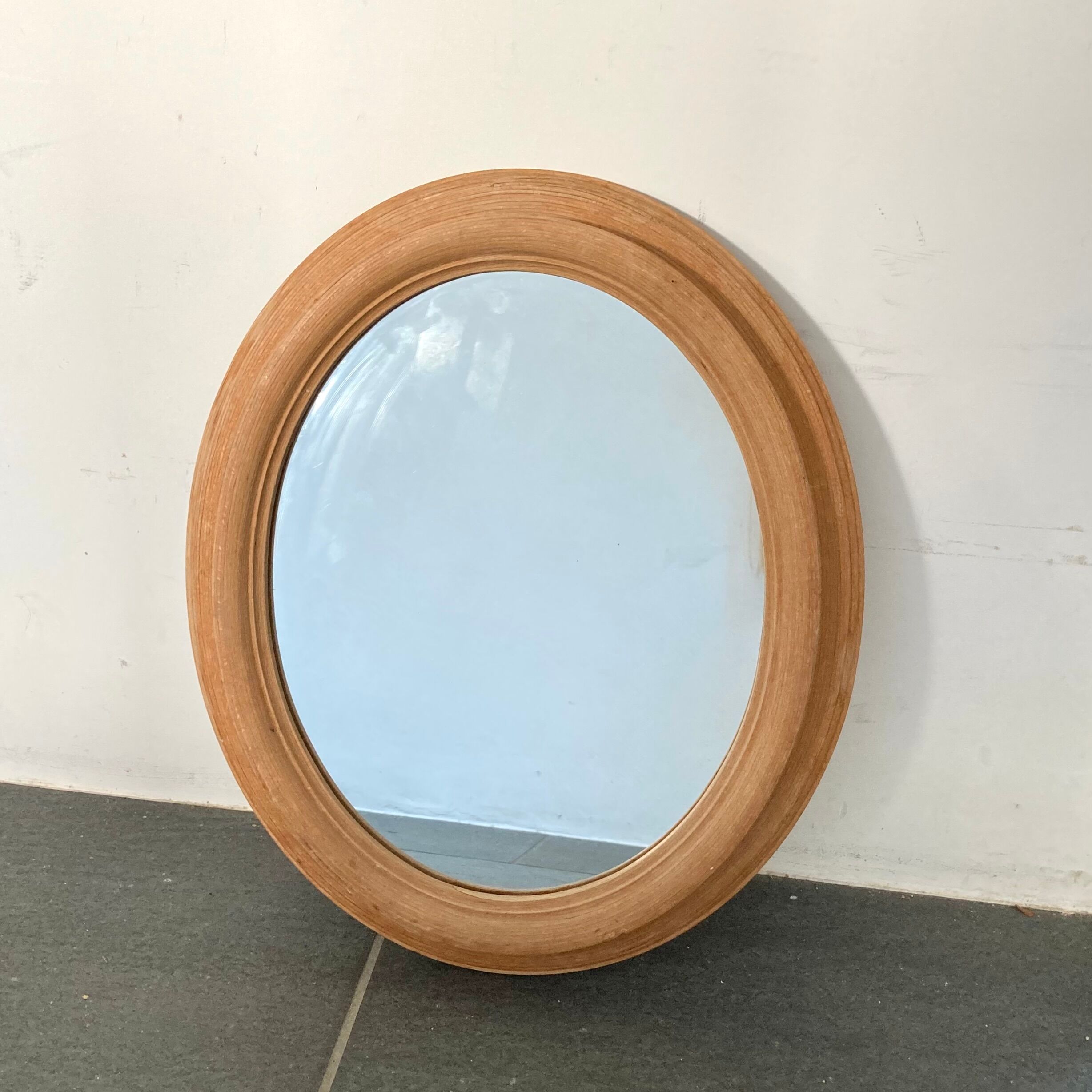 Oval wooden mirror 31x37cm