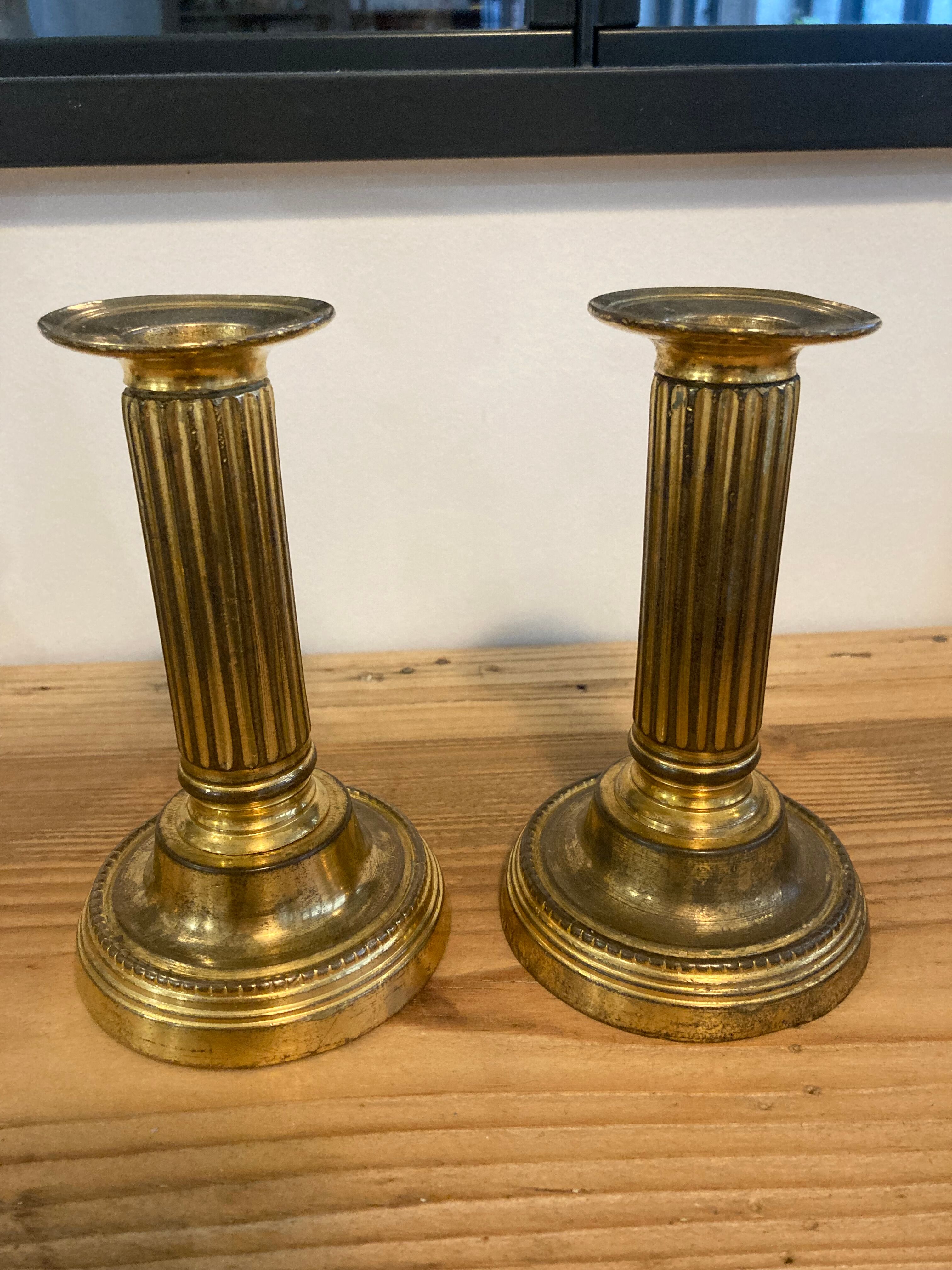 Pair of Louis XVI candlesticks in gilded bronze