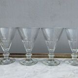 4 glasses of moulded pressed glass wine on foot