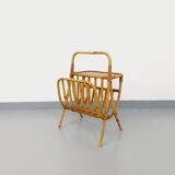 Side table with vintage rattan and wood magazine rack from the 60s