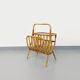 Side table with vintage rattan and wood magazine rack from the 60s