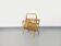 Side table with vintage rattan and wood magazine rack from the 60s