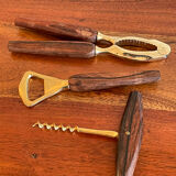 Bottle opener made of teak wood, corkscrew and nutcracker