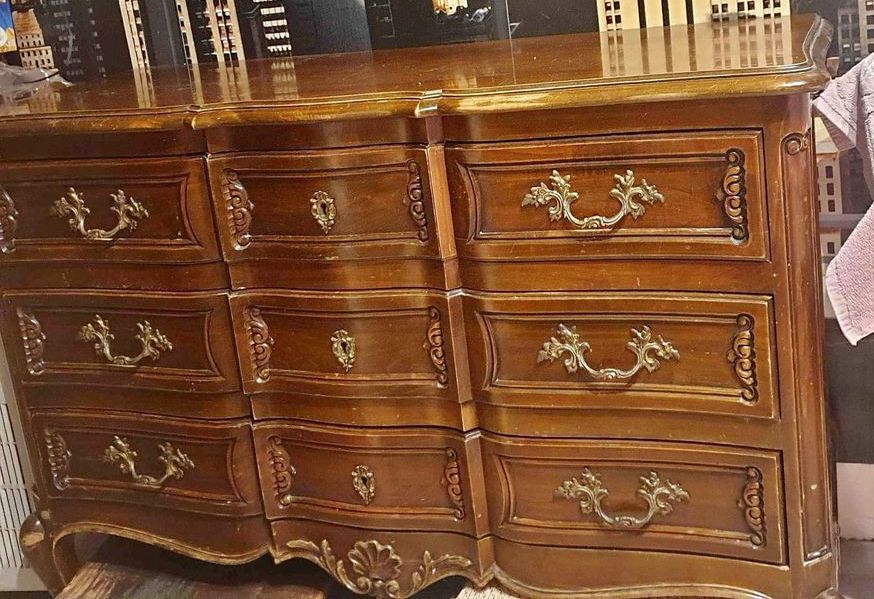 Patinated baroque crossbow chest of drawers