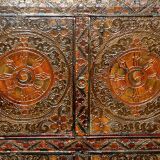 Antique polychrome Tibetan altar cabinet with deer and flowers.