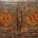 Antique polychrome Tibetan altar cabinet with deer and flowers.