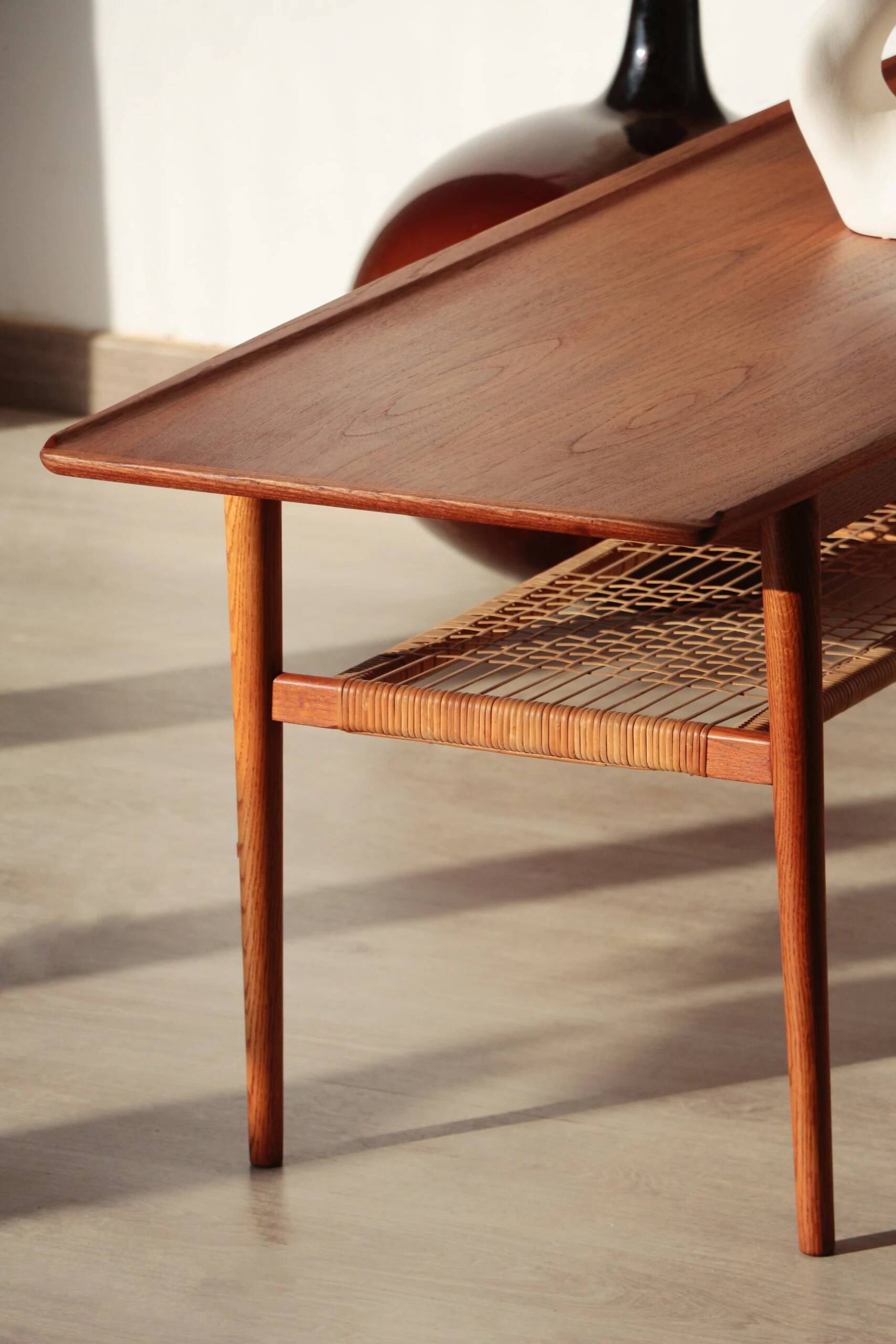 Vintage Scandinavian coffee table in teak and rattan – Danish design from the 1960s.