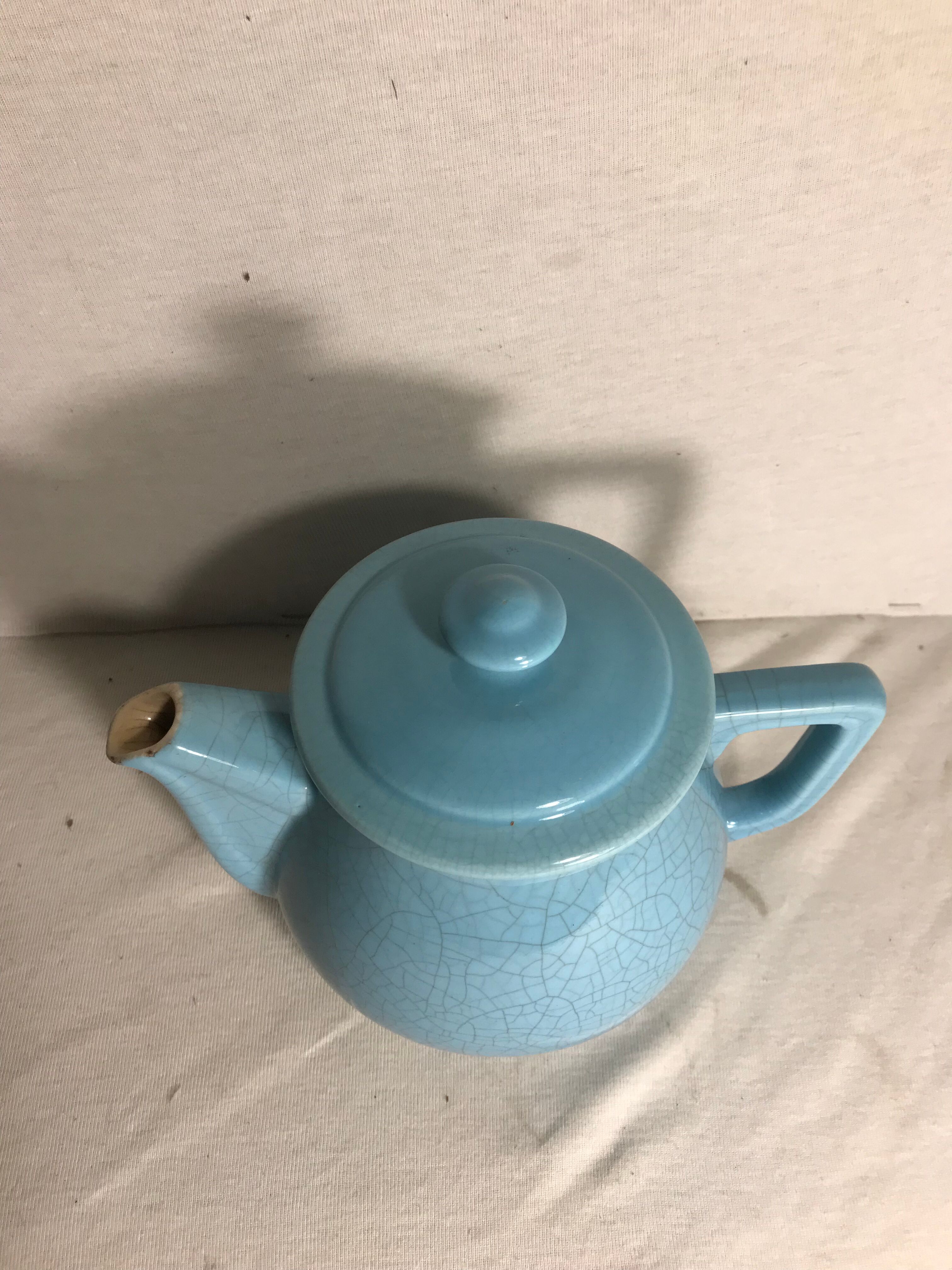 Cracked blue ceramic vintage teapot