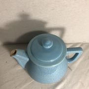 Cracked blue ceramic vintage teapot