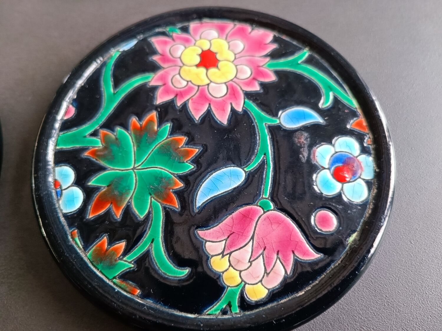 Pair of Longwy flower bottle underwear on black background. Rare