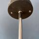 Vintage pendant light with three green spots.