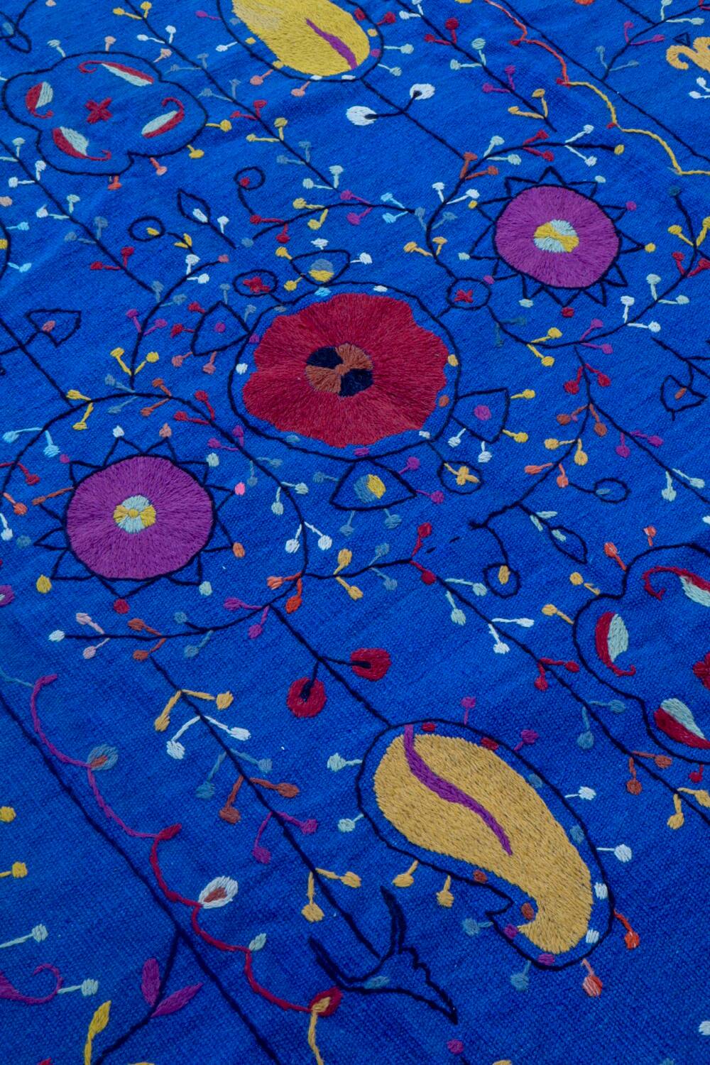 Midnight blue suzani kilim rug with embroidered patterns