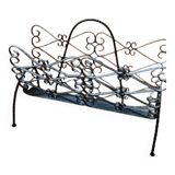 Vintage black wrought iron magazine rack