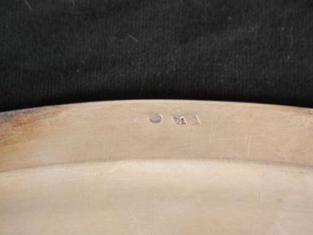Flat oval silver metal