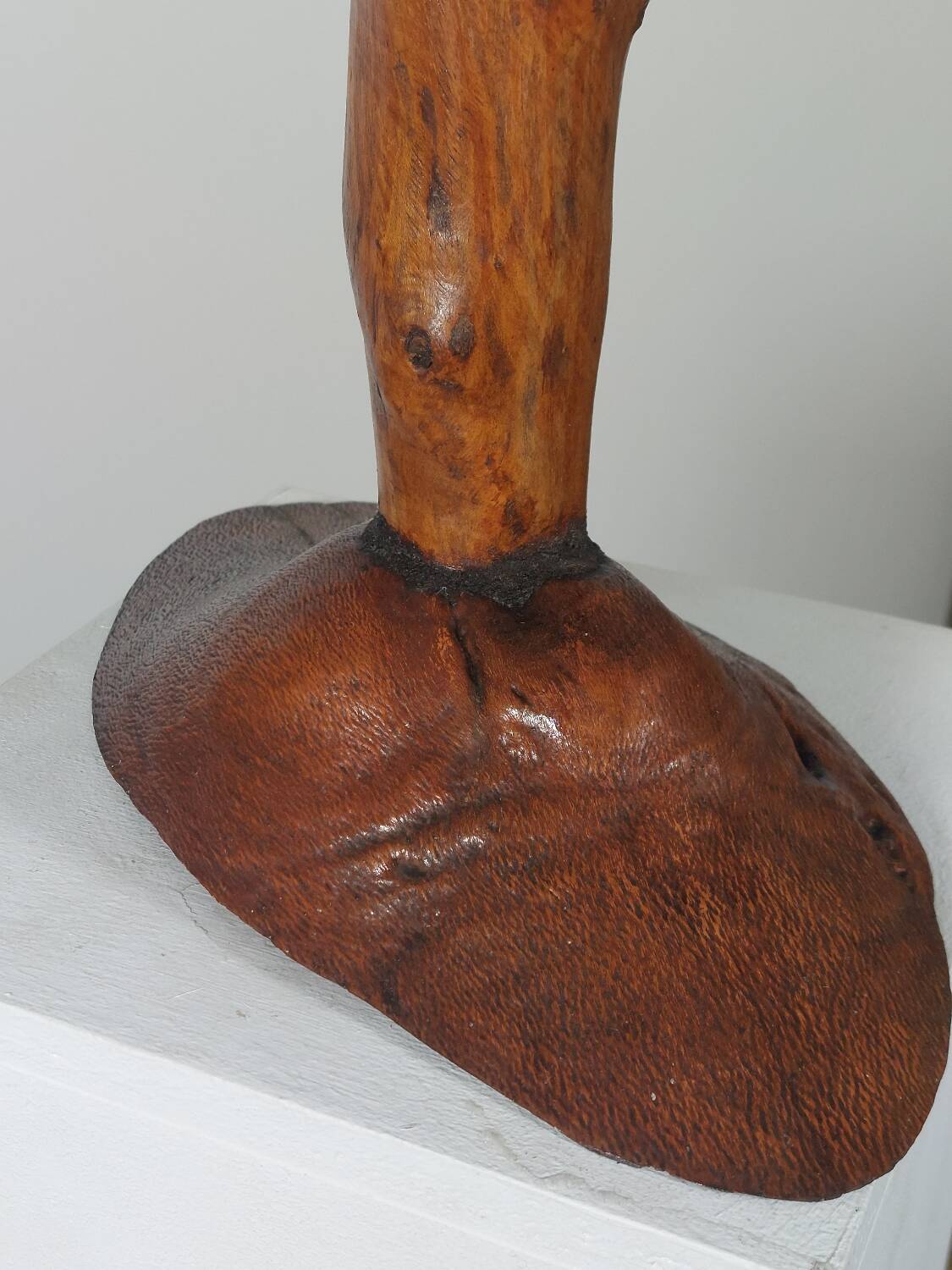 Vintage candle holder in an organic shape with a brass spike and tiered top.