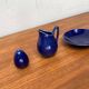Swedish Salier Mid-Century Bla Eld, Salt Shaker, Milk Jug, Saucer and Plate by Hertha Bengtson for Rörstrand, 1960s, Set of 4
