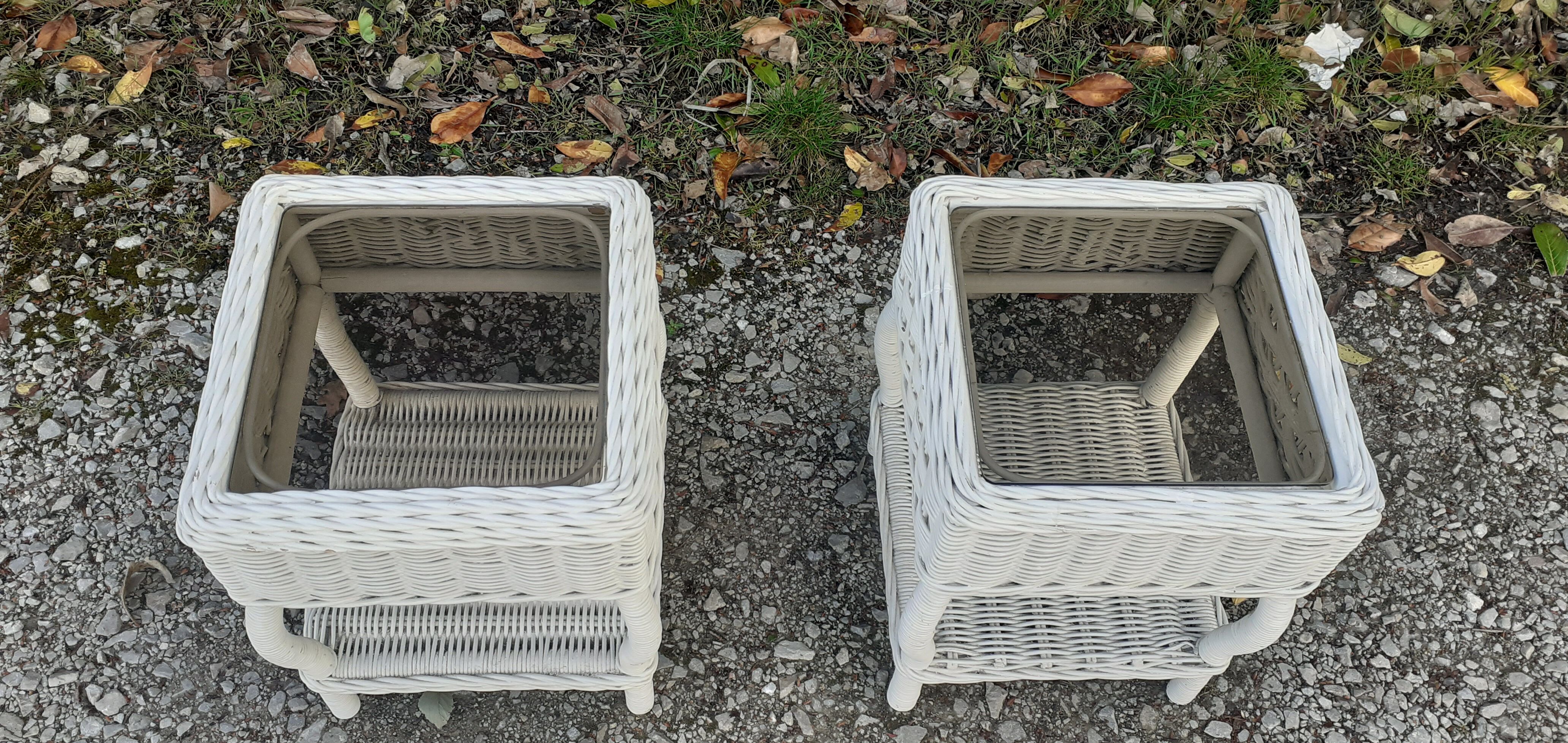Pairs of white rattan side tables and smoked glass