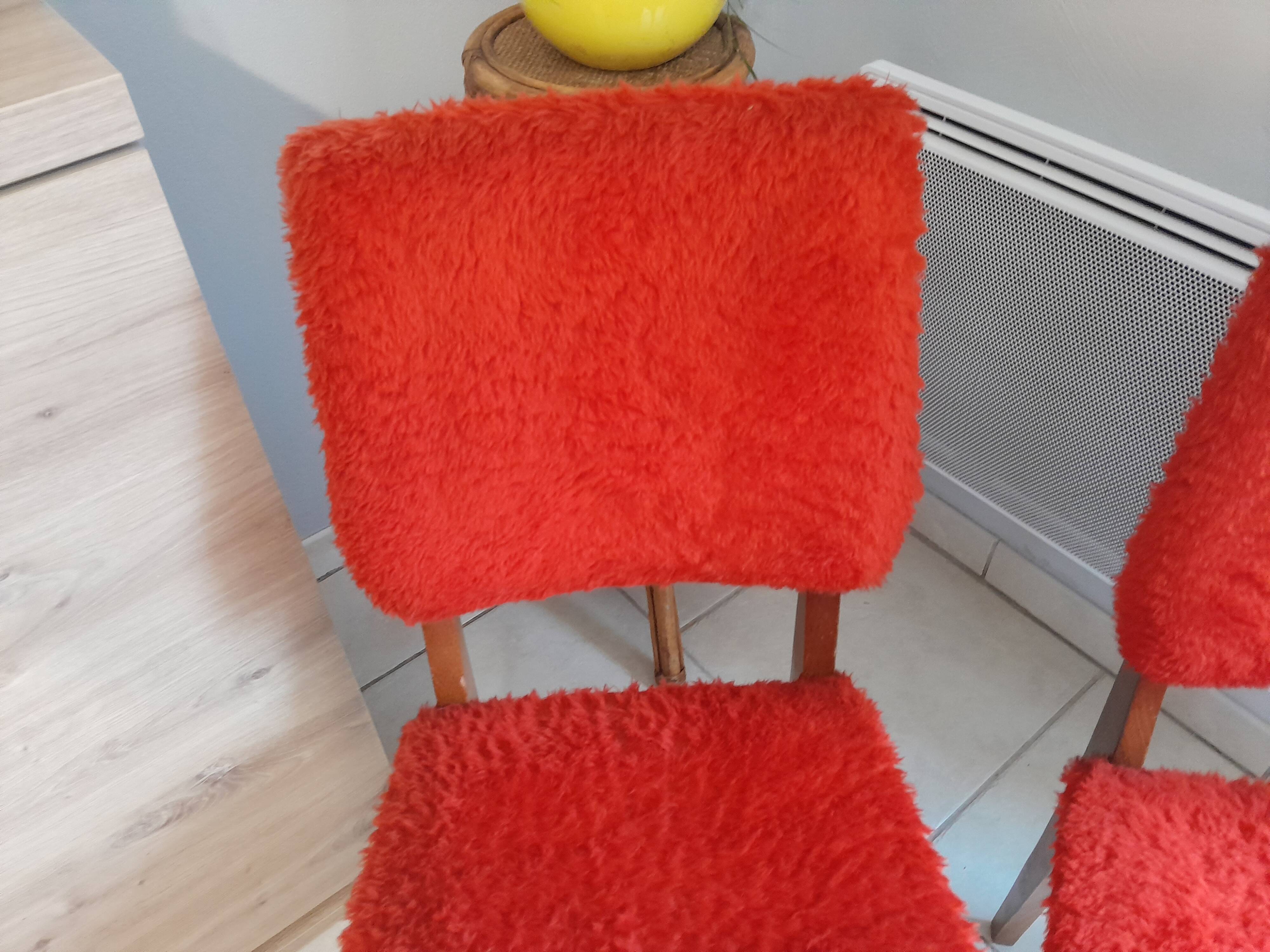 Pair of vintage red moumoute chairs with compass legs
