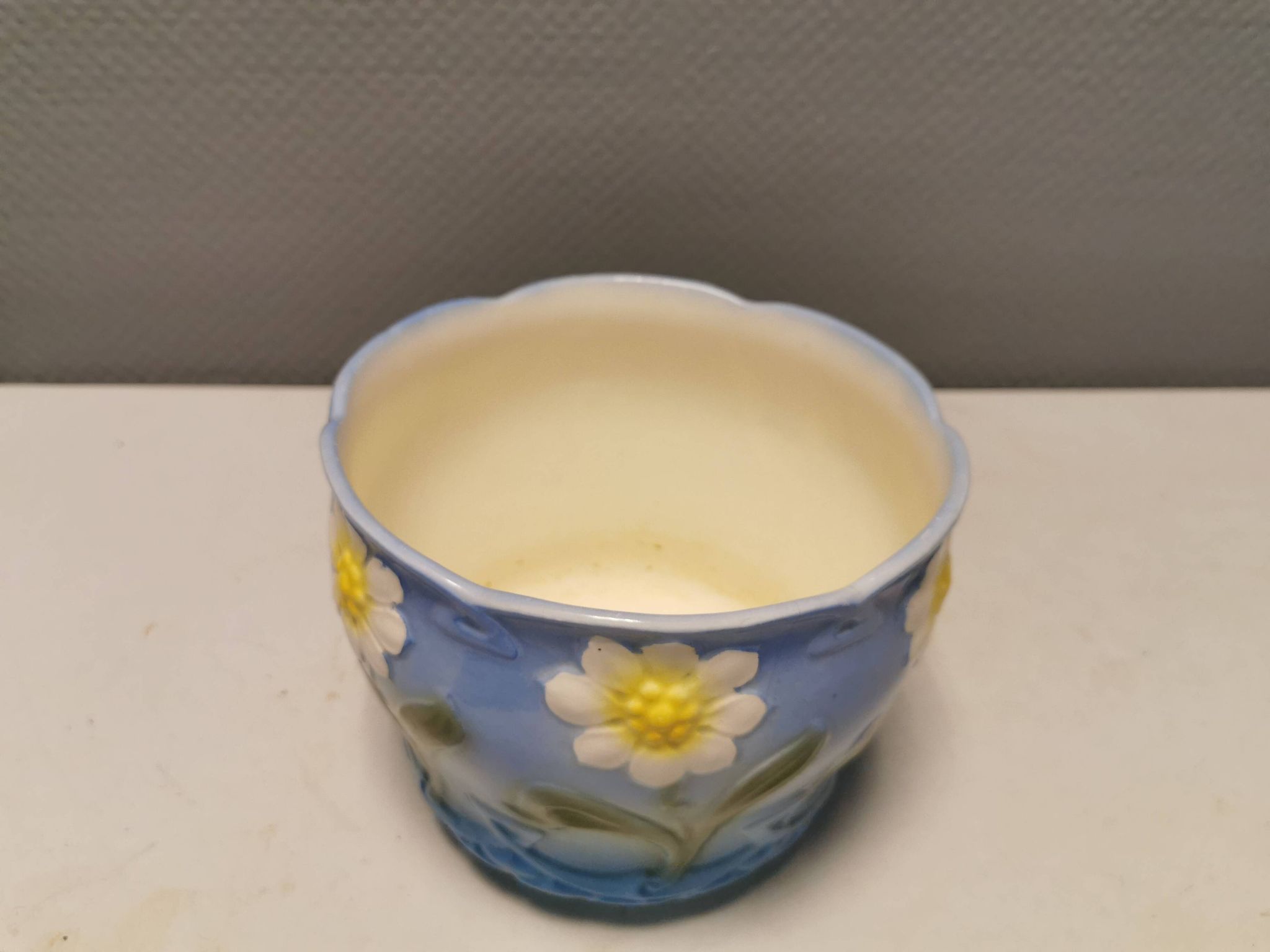 Very beautiful flower pot in soft blue and white color with floral motifs.