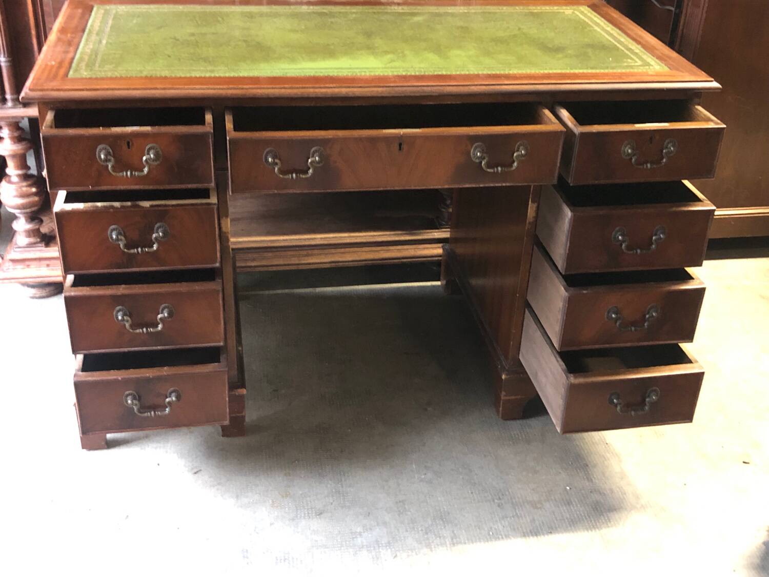 English pedestal desk with green leather top