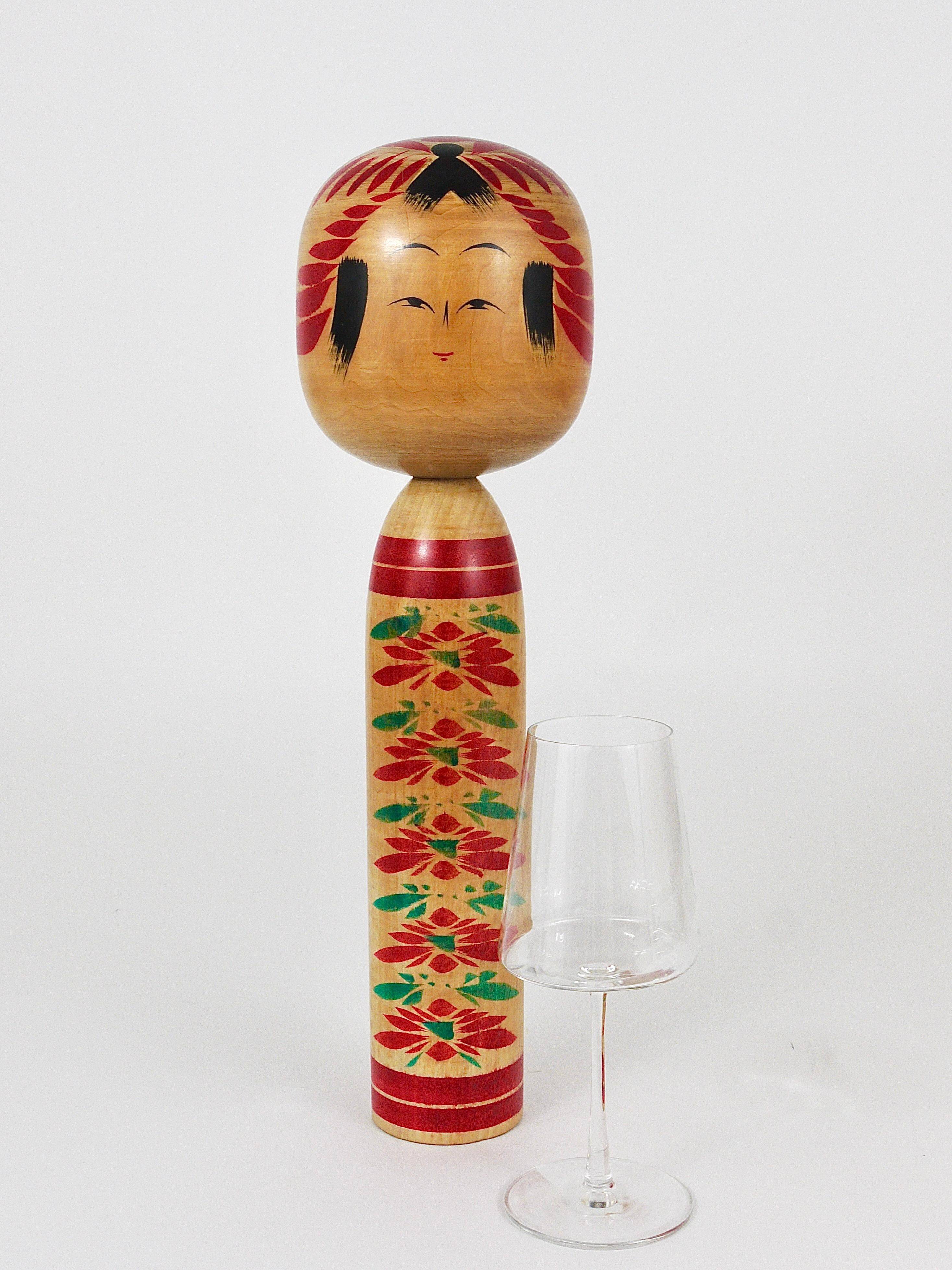 Decorative Togatta Kokeshi doll sculpture from northern Japan, hand-painted.