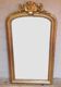 Golden mirror with pediment XIXth