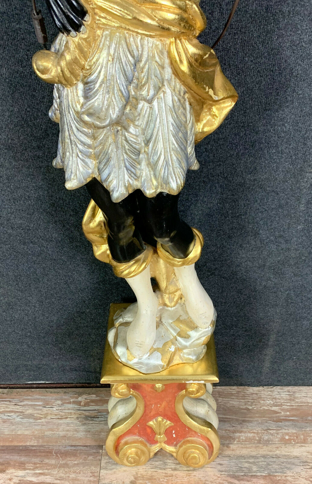 Early XXth era polychrome wooden torch has figuration of a Moor in traditional costume from the 18th