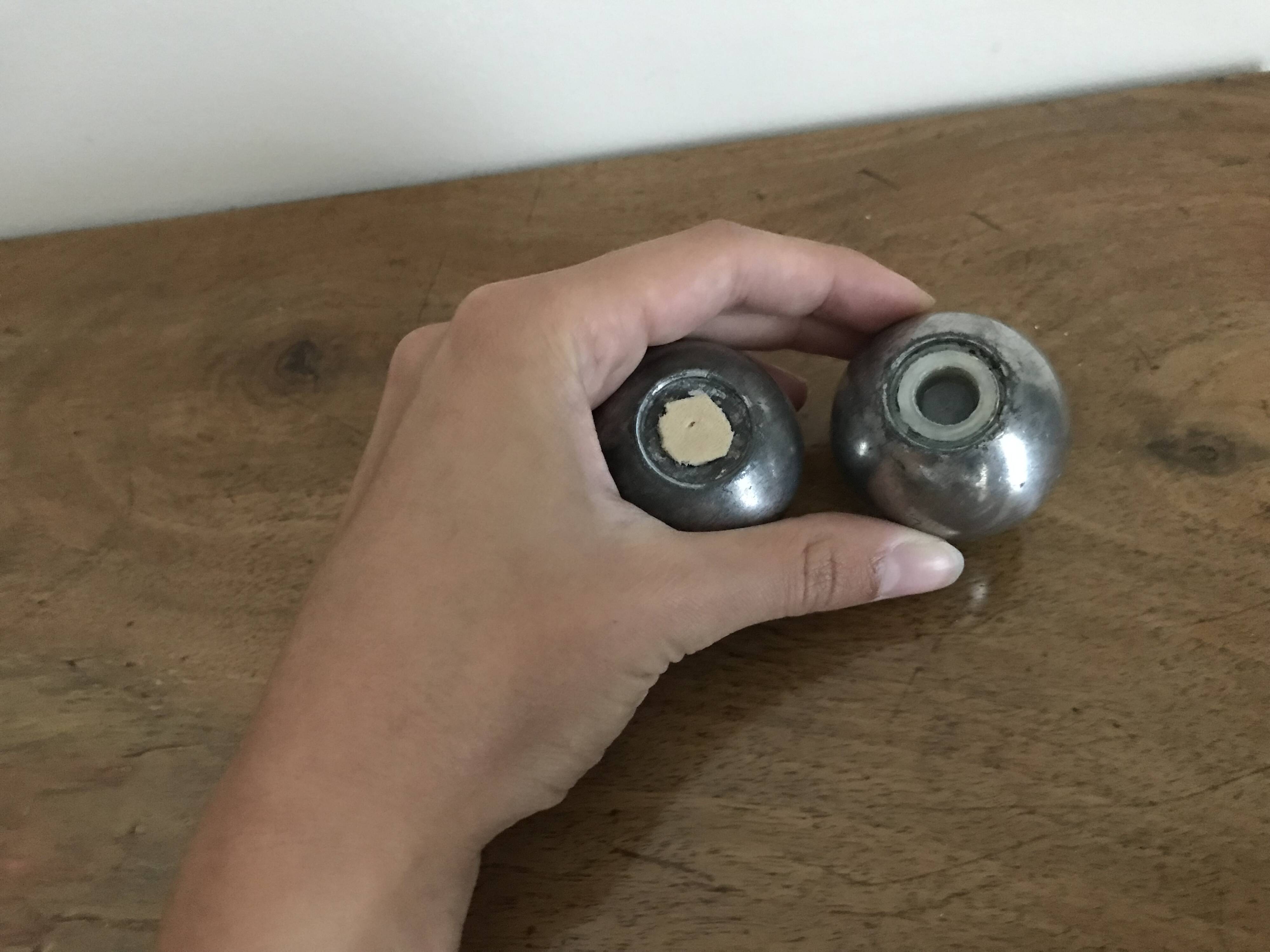Brutalist salt and pepper ball in cast steel