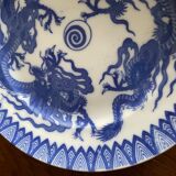 Asian porcelain plates decorated with blue dragons