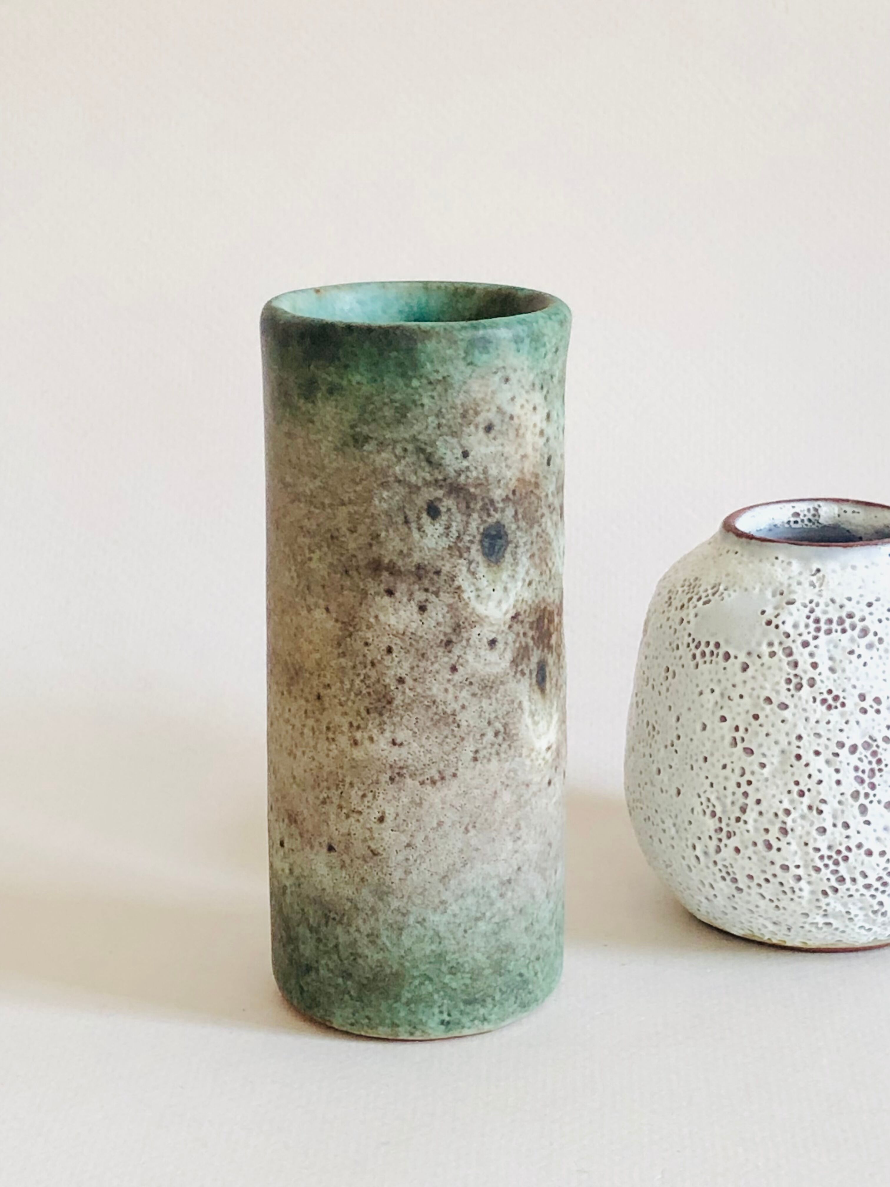 Duo of small sandstone vases