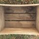 Wooden box with black letters