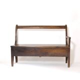 Handcrafted wooden bench with armrest and left drawer.
