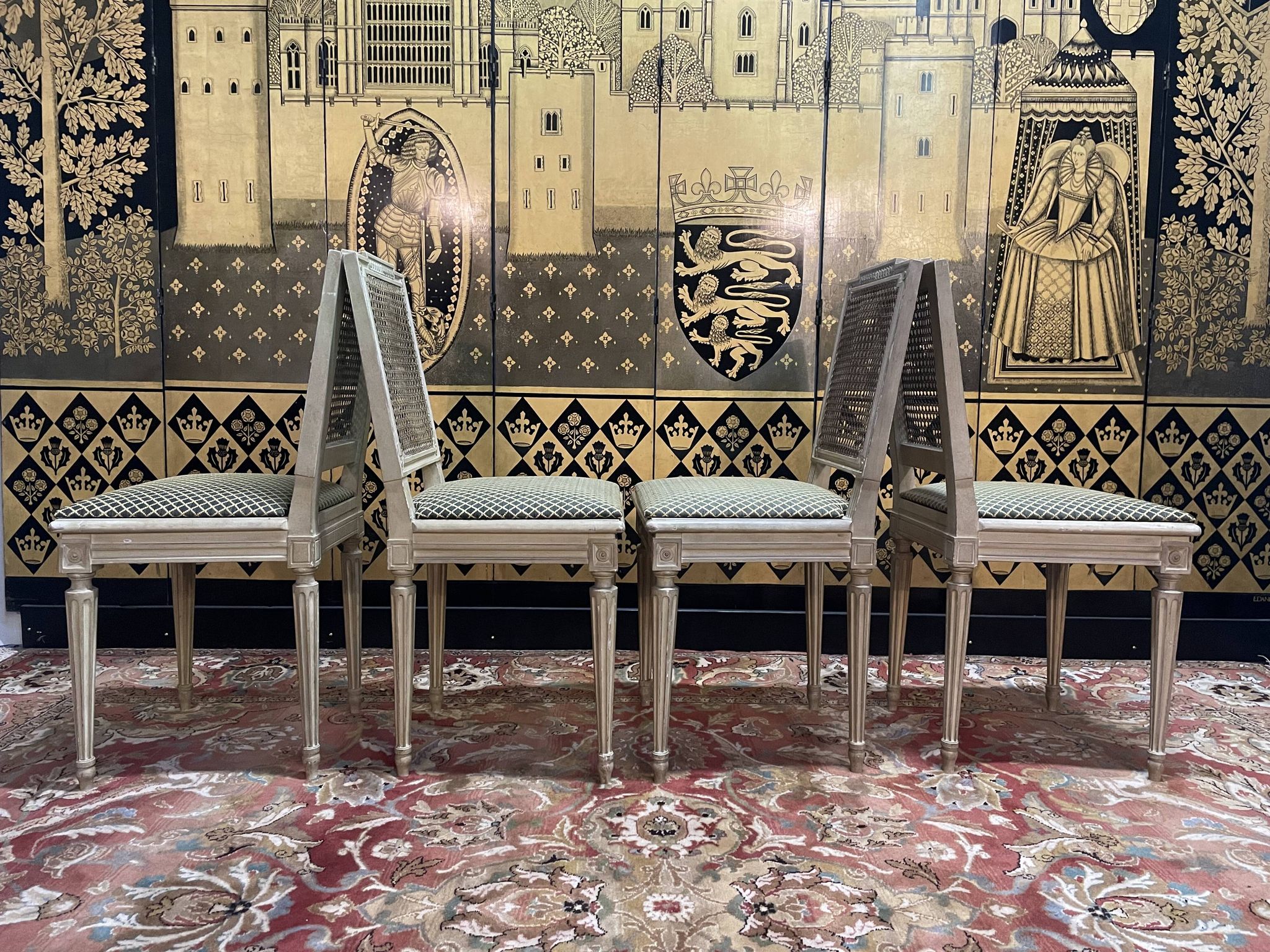 Suite de 4 chaises cannées style Louis XVI Jean Mocque