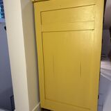 Yellow wooden chest of drawers