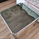 Table basse piètement chromé et plateau en verre fumé noir