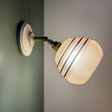 Vintage globe wall light in frosted pink and gold glass.