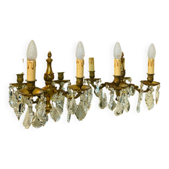 Pair of gilt bronze wall sconces with pendants from the mid-20th century.