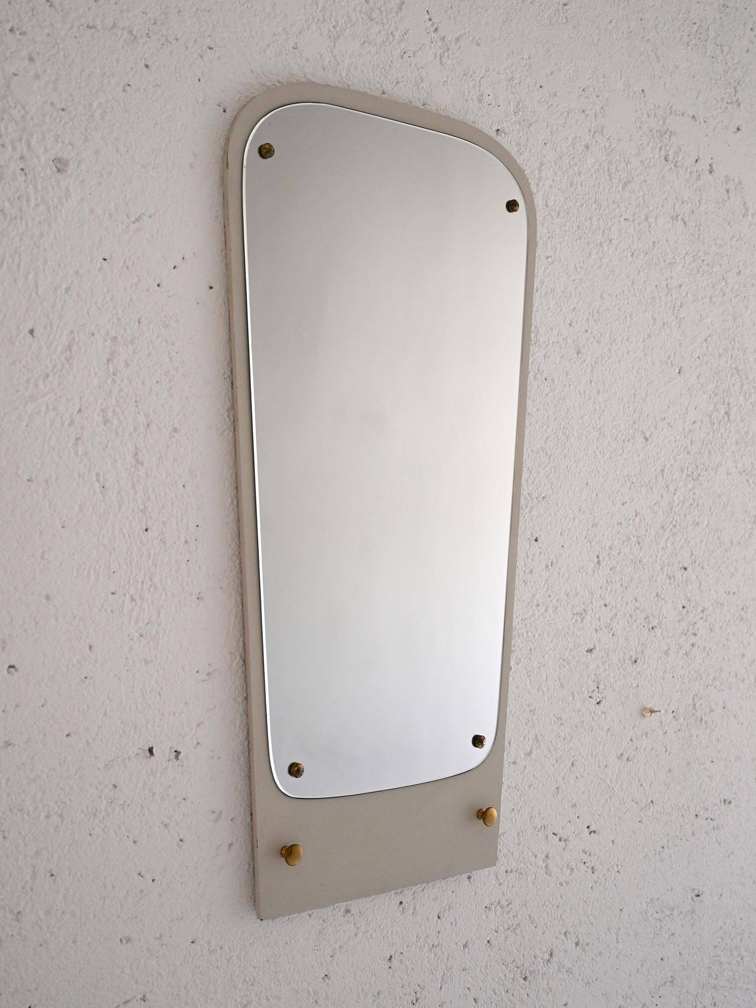 Decorative mirror with white painted wooden frame and gold details