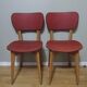 Two vintage chairs wood and mottled red vinyl