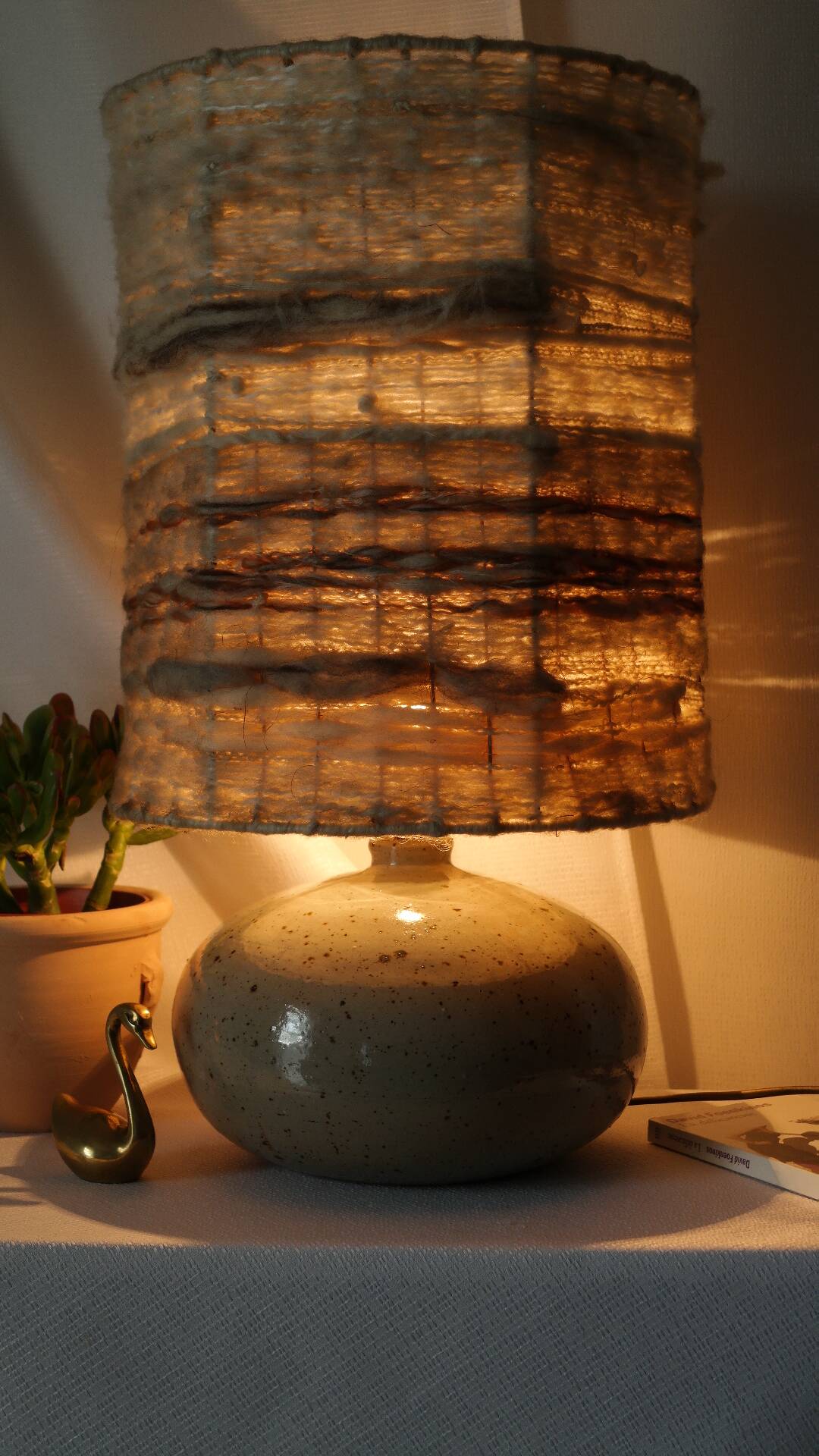 Vintage ceramic lamp with a wool shade.