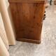 Antique English commode in flame walnut.