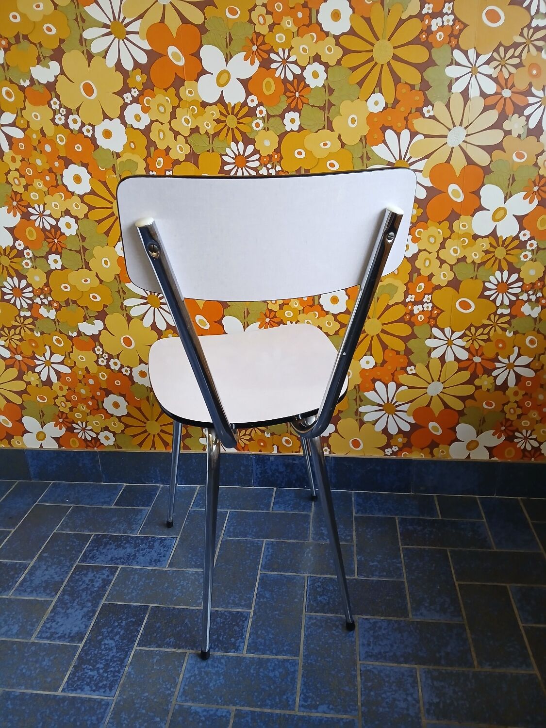 Extendable formica table and vintage 1960s chairs.