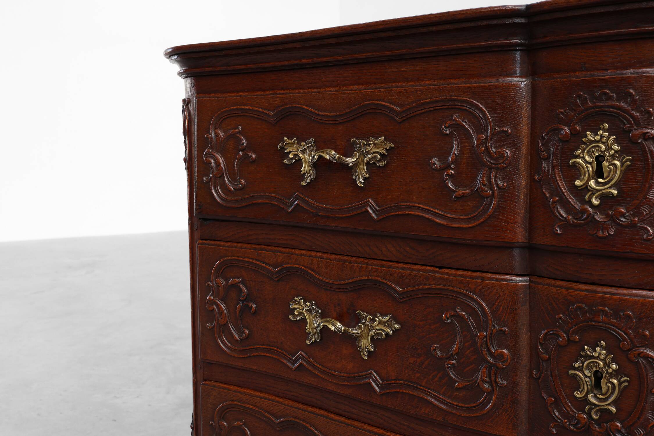 French 18th Century hand crafted oak chest of drawers in Louis XV style