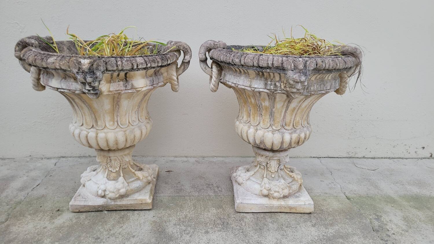 Pair of planter vases decorated with faces in reconstituted stone 1950s