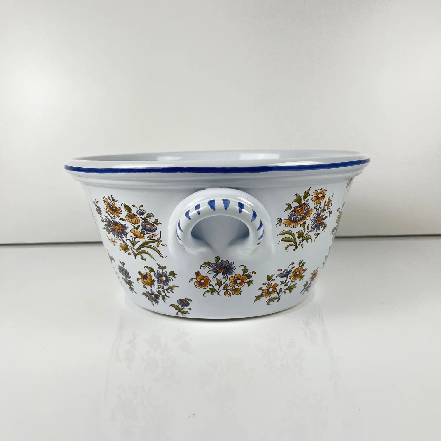Large hand-painted earthenware salad bowl, signed "Mousiters", 20th century.