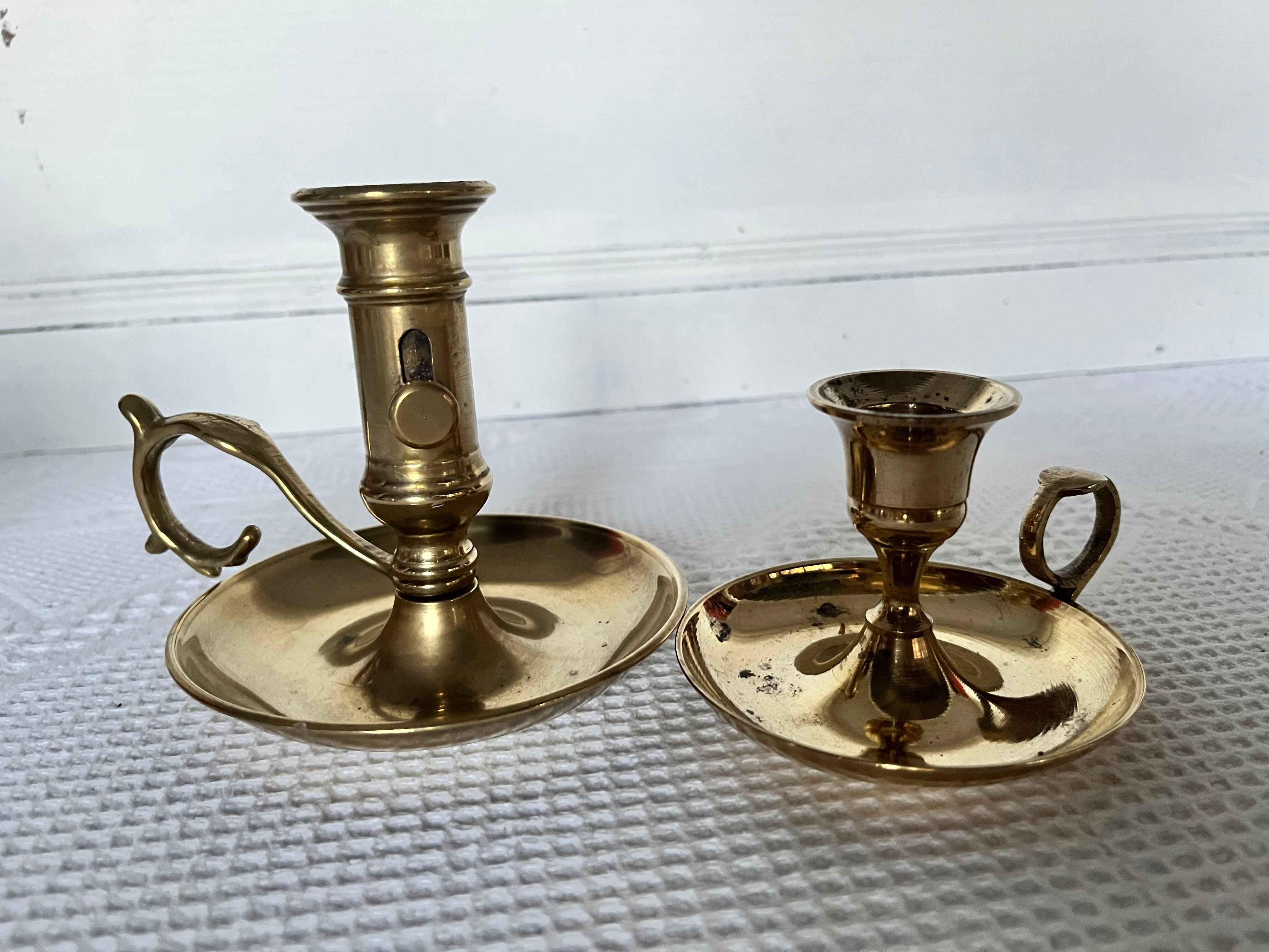 Duo of brass hand candle holders