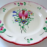 Eastern earthenware plate with floral decoration centered with a tulip