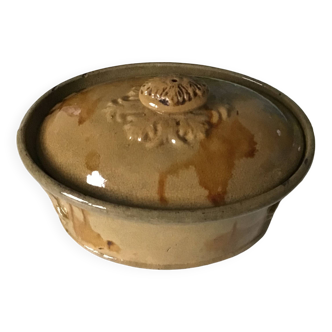 Old terrine of pastry or foie gras in beige glazed earthenware with brown drips. Very beautiful pa