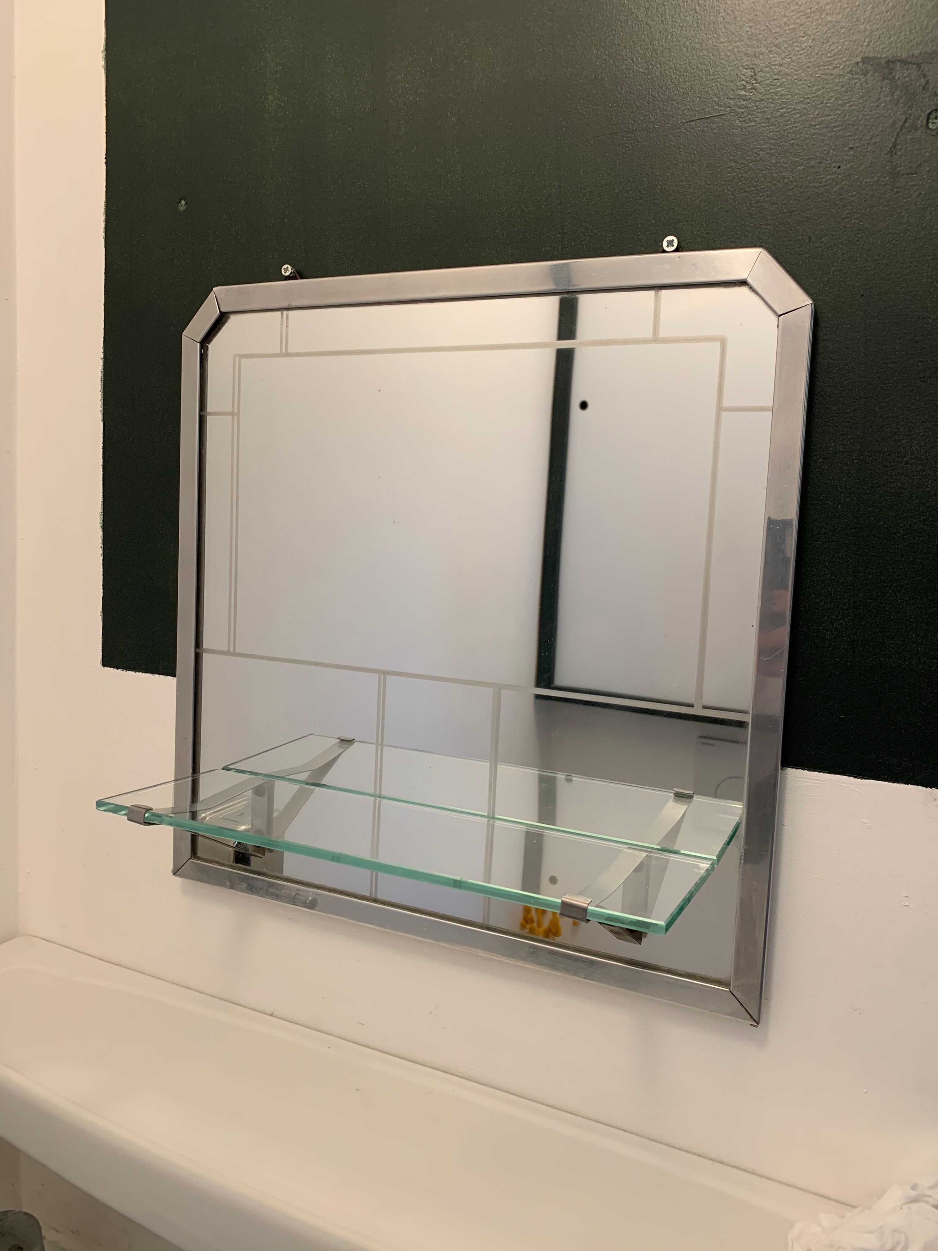 Bathroom mirror with art deco shelf