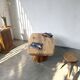 Organic brutalist coffee table in solid cedar, trunk pedestal, 1970s.